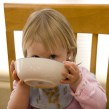 Toddler eating stock image